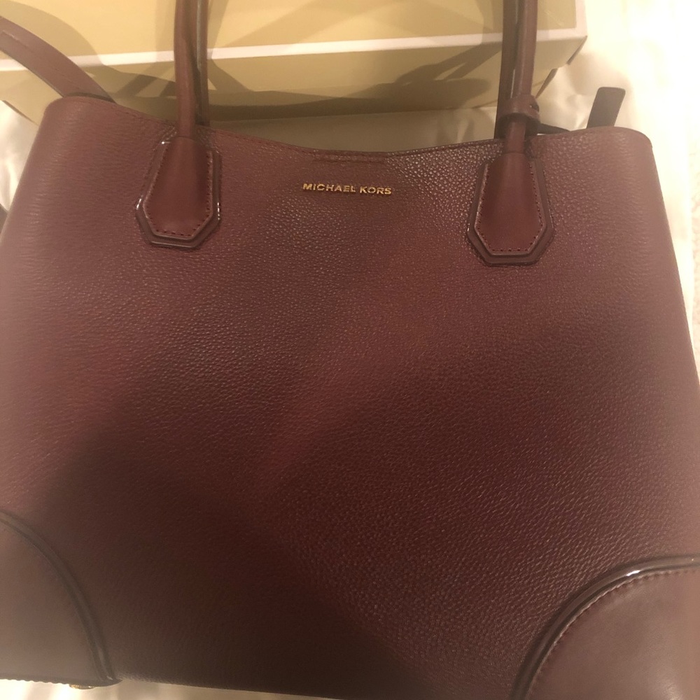 Authentic Michael Kors purse 11 1/2 height,14 length.My initials are engravedJMO